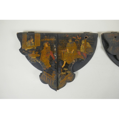 277 - A pair of Japanese export Japanned papier mache folding brackets, decorated with geisha and their pa... 