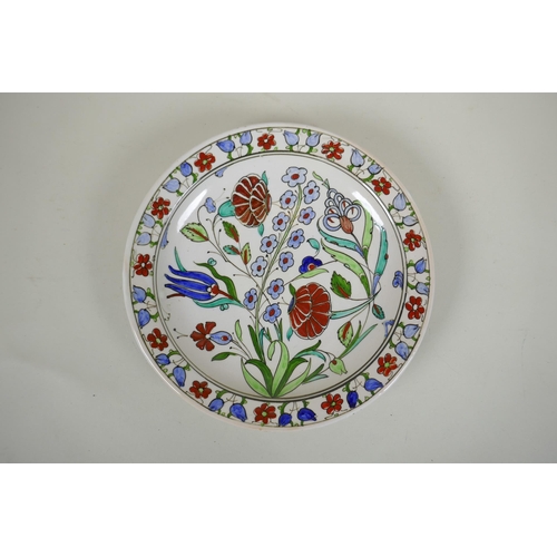 283 - An Iznik style Greek pottery charger by Icaro Rodi with hand painted floral decoration, and another ... 