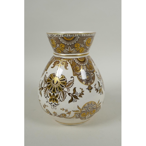 284 - An antique Wedgwood ironstone water pitcher with gilt Grecian style decoration, 17cm high