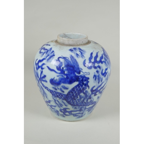 33 - A Chinese C19th blue and white porcelain ginger jar decorated with a dragon chasing the flaming pear... 