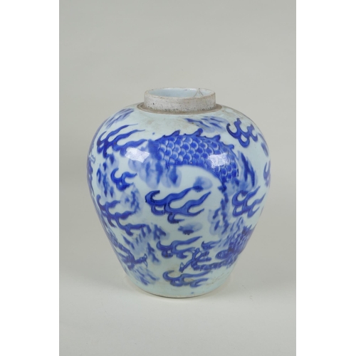 33 - A Chinese C19th blue and white porcelain ginger jar decorated with a dragon chasing the flaming pear... 