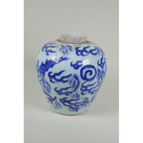 33 - A Chinese C19th blue and white porcelain ginger jar decorated with a dragon chasing the flaming pear... 