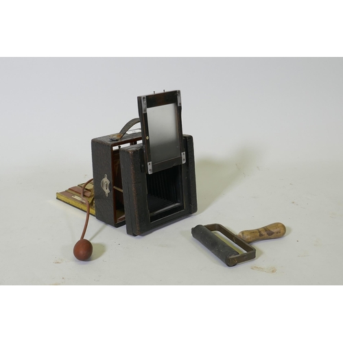 37 - A Victorian bellows camera mahogany with brass mounts, in leather covered case, Koilos shutter and l... 