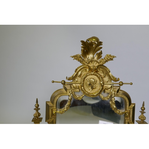 5 - A C19th French ormolu toilet mirror on an onyx base, decorated with putti, swags and torcheres, 66cm... 