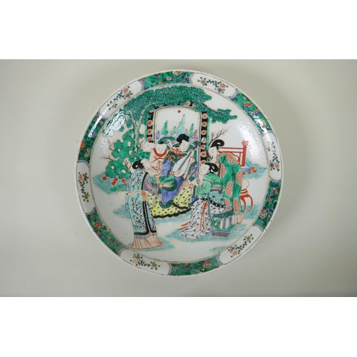 50 - A Chinese KangXi style famille vert porcelain charger, decorated with women playing music, mark to b... 