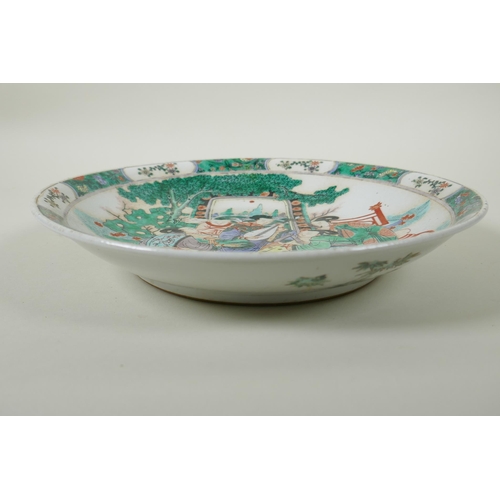 50 - A Chinese KangXi style famille vert porcelain charger, decorated with women playing music, mark to b... 