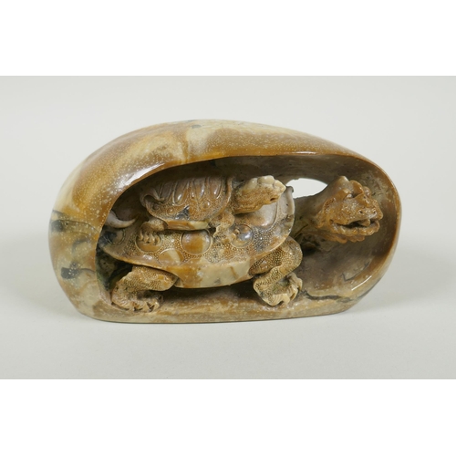 56 - A Chinese reconstituted stone carving of a tortoise and its young, 17cm long