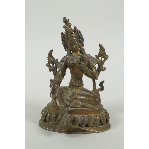 58 - A Tibetan bronze figure of Green Tara with inset turquoise beads, inscription verso, 12cm high