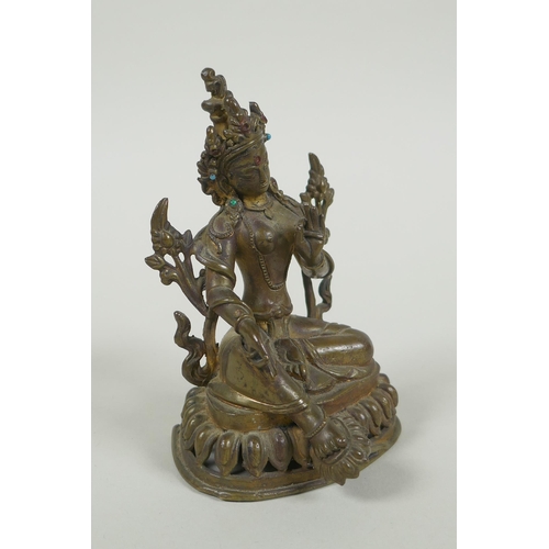 58 - A Tibetan bronze figure of Green Tara with inset turquoise beads, inscription verso, 12cm high