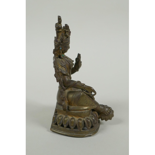 58 - A Tibetan bronze figure of Green Tara with inset turquoise beads, inscription verso, 12cm high