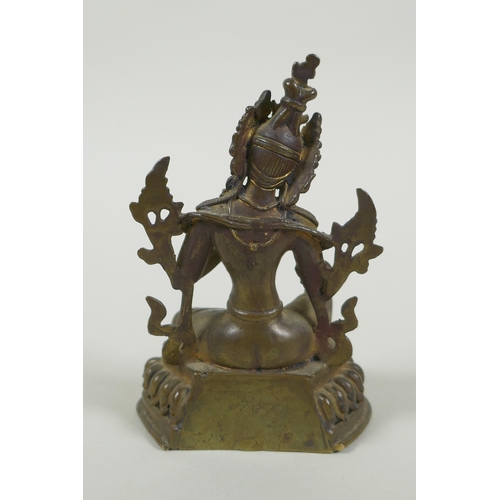 58 - A Tibetan bronze figure of Green Tara with inset turquoise beads, inscription verso, 12cm high