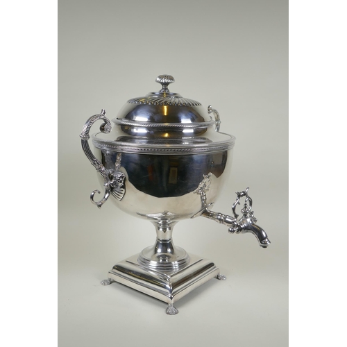 602 - A fine Victorian silver plated samovar/tea urn, with two handles and paw feet, the cover interior in... 