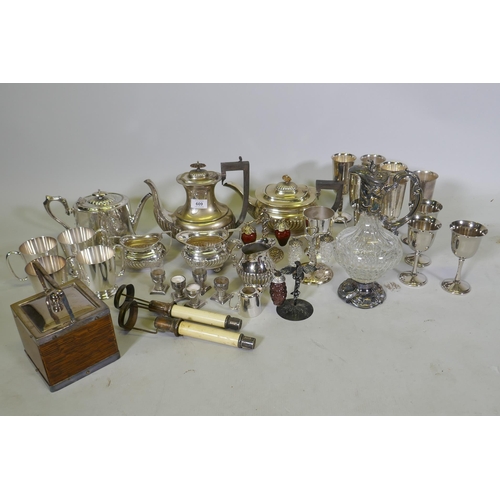 609 - A quantity of silver plated ware, a biscuit barrel and cut glass claret jug