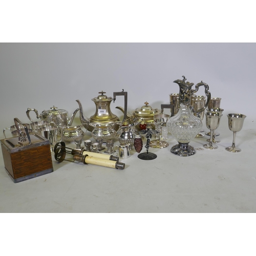 609 - A quantity of silver plated ware, a biscuit barrel and cut glass claret jug