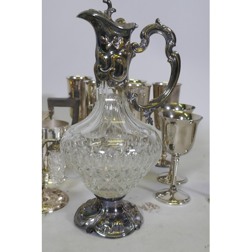 609 - A quantity of silver plated ware, a biscuit barrel and cut glass claret jug