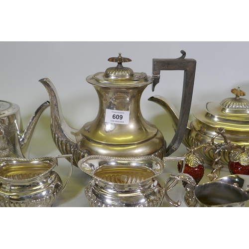 609 - A quantity of silver plated ware, a biscuit barrel and cut glass claret jug