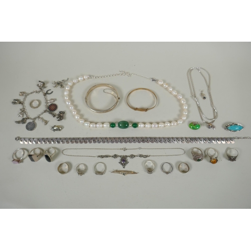 617 - A quantity of vintage silver costume jewellery to include rings, charms, bangles etc, mostly all sil... 