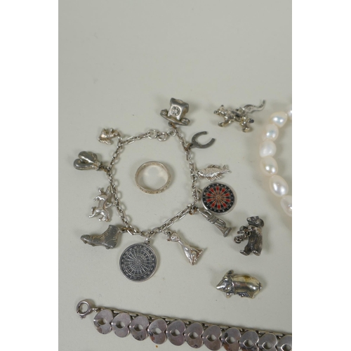 617 - A quantity of vintage silver costume jewellery to include rings, charms, bangles etc, mostly all sil... 