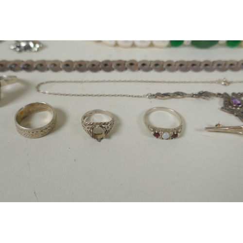 617 - A quantity of vintage silver costume jewellery to include rings, charms, bangles etc, mostly all sil... 