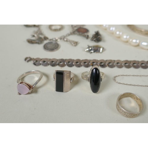 617 - A quantity of vintage silver costume jewellery to include rings, charms, bangles etc, mostly all sil... 