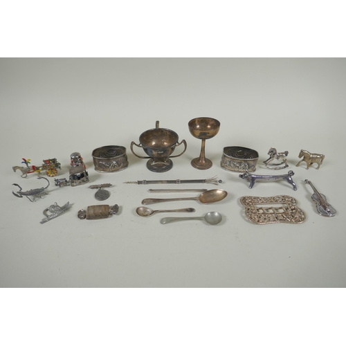 618 - A quantity of silver items to include belt buckles, napkin rings, cups, knife rests, etd, 230g, and ... 