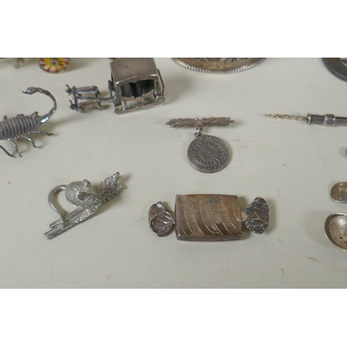 618 - A quantity of silver items to include belt buckles, napkin rings, cups, knife rests, etd, 230g, and ... 