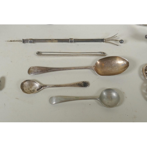 618 - A quantity of silver items to include belt buckles, napkin rings, cups, knife rests, etd, 230g, and ... 