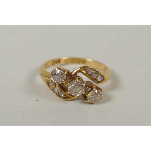 626 - A vintage 18ct gold diamond trilogy twist ring, approx 0.7ct, size P, 4.6g gross