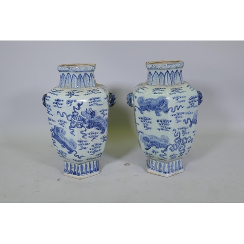 63 - A pair of Chinese blue and white per hexagonal vases with two lion mask handles and kylin decoration... 