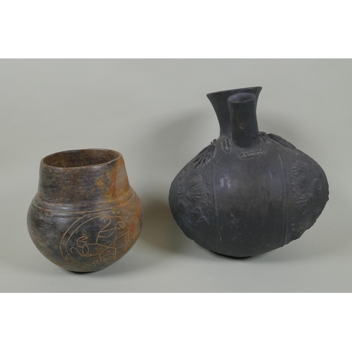 64 - A Peruvian Chimu style Blackware double spout vessel, and another South American pottery vase, large... 