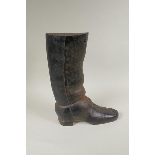 67 - A painted cast iron door stop in the form of a riding boot, 36cm high