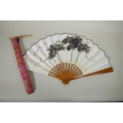 68 - A Chinese bamboo fan with watercolour decoration of gourds, character inscription to the reverse, wi... 