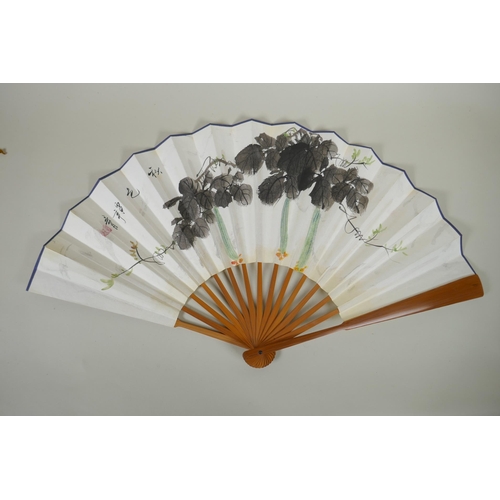 68 - A Chinese bamboo fan with watercolour decoration of gourds, character inscription to the reverse, wi... 