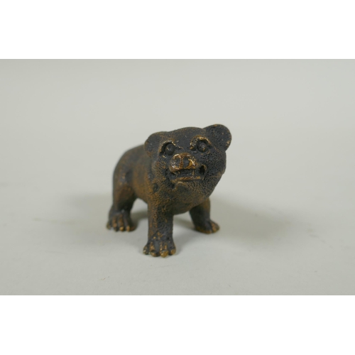 74 - An antique bronze figure of a bear cub, 7cm long