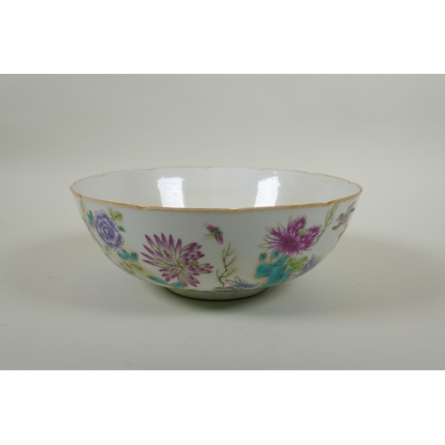 75 - A C19th Chinese famille rose porcelain bowl with lobed rim, decorated with birds amongst asiatic flo... 