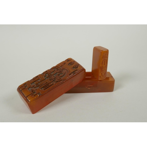 78 - A Chinese amber soapstone seal and matching box with carved archaic dragon decorated to the cover, c... 