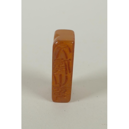 78 - A Chinese amber soapstone seal and matching box with carved archaic dragon decorated to the cover, c... 