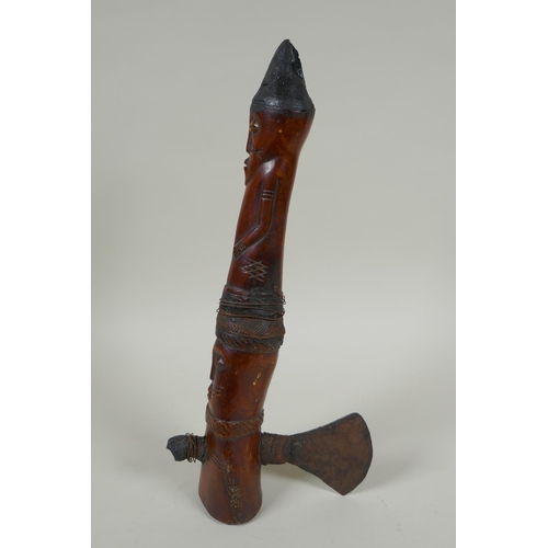 79 - An early C20th African carved bone Shamanic axe, with figural decoration, possibly Yoruba tribe, 33c... 