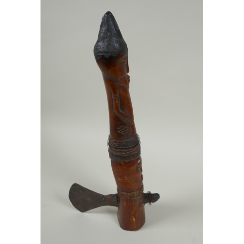 79 - An early C20th African carved bone Shamanic axe, with figural decoration, possibly Yoruba tribe, 33c... 