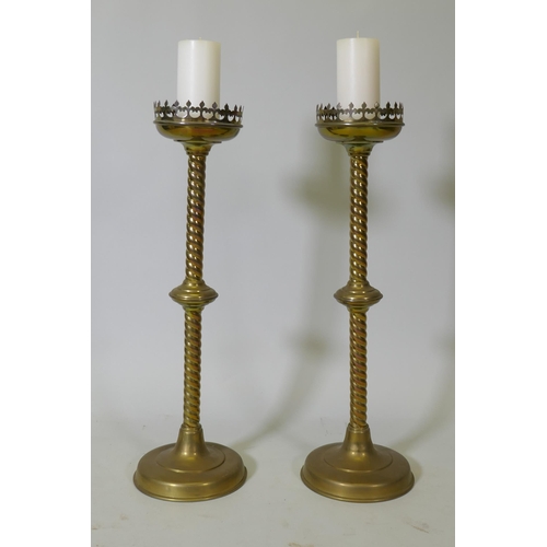 8 - A pair of brass pricket candlesticks, 68cm high