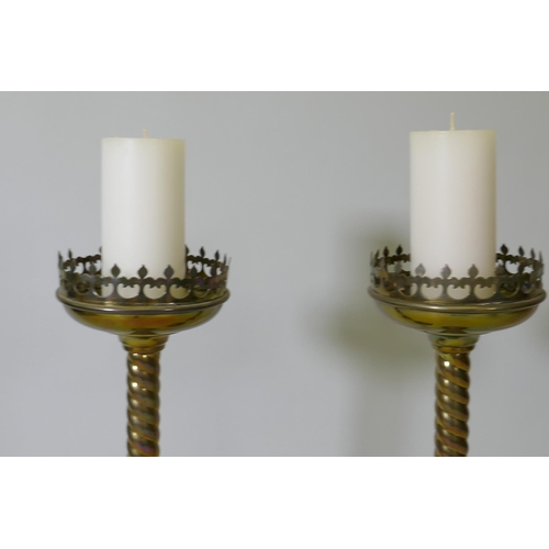 8 - A pair of brass pricket candlesticks, 68cm high