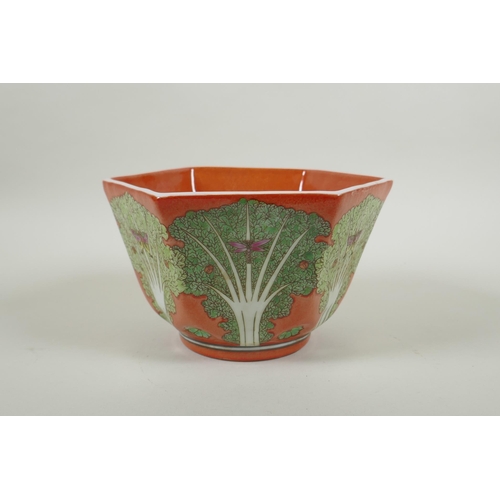 81 - A Chinese coral red ground porcelain bowl of hexagonal form, with polychrome enamel decoration of ca... 