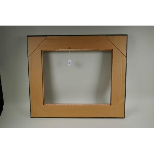 811 - A C20th gilt picture frame with scroll and floret decoration, rebate 51 x 41cm