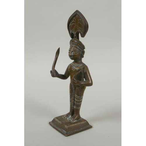 82 - An antique Indian bronze figure, with bow and short sword/septre, 19cm high