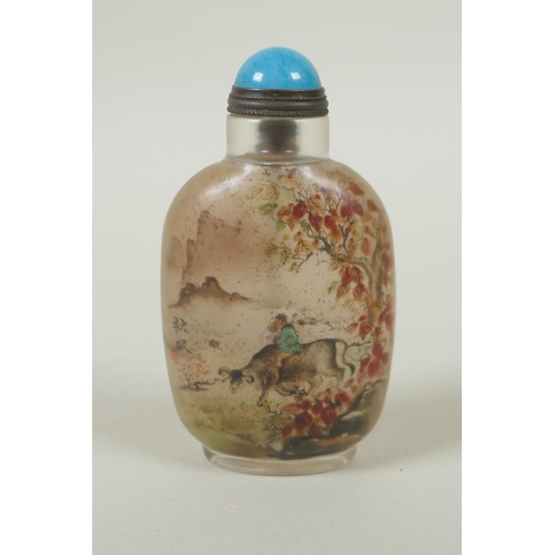 85 - A Chinese reverse decorated glass snuff bottle depicting boys and water buffalo, 9cm high