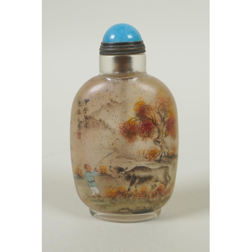 85 - A Chinese reverse decorated glass snuff bottle depicting boys and water buffalo, 9cm high