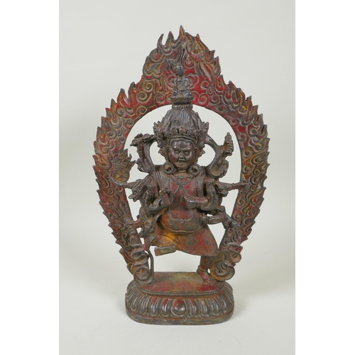 88 - A Tibetan bronze figure of Mahakala, with remnants of gilt patina, 33cm high, double vajra mark to b... 