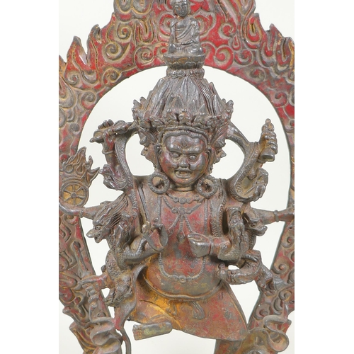 88 - A Tibetan bronze figure of Mahakala, with remnants of gilt patina, 33cm high, double vajra mark to b... 