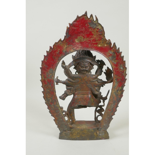 88 - A Tibetan bronze figure of Mahakala, with remnants of gilt patina, 33cm high, double vajra mark to b... 