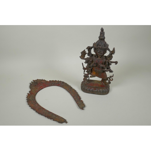 88 - A Tibetan bronze figure of Mahakala, with remnants of gilt patina, 33cm high, double vajra mark to b... 